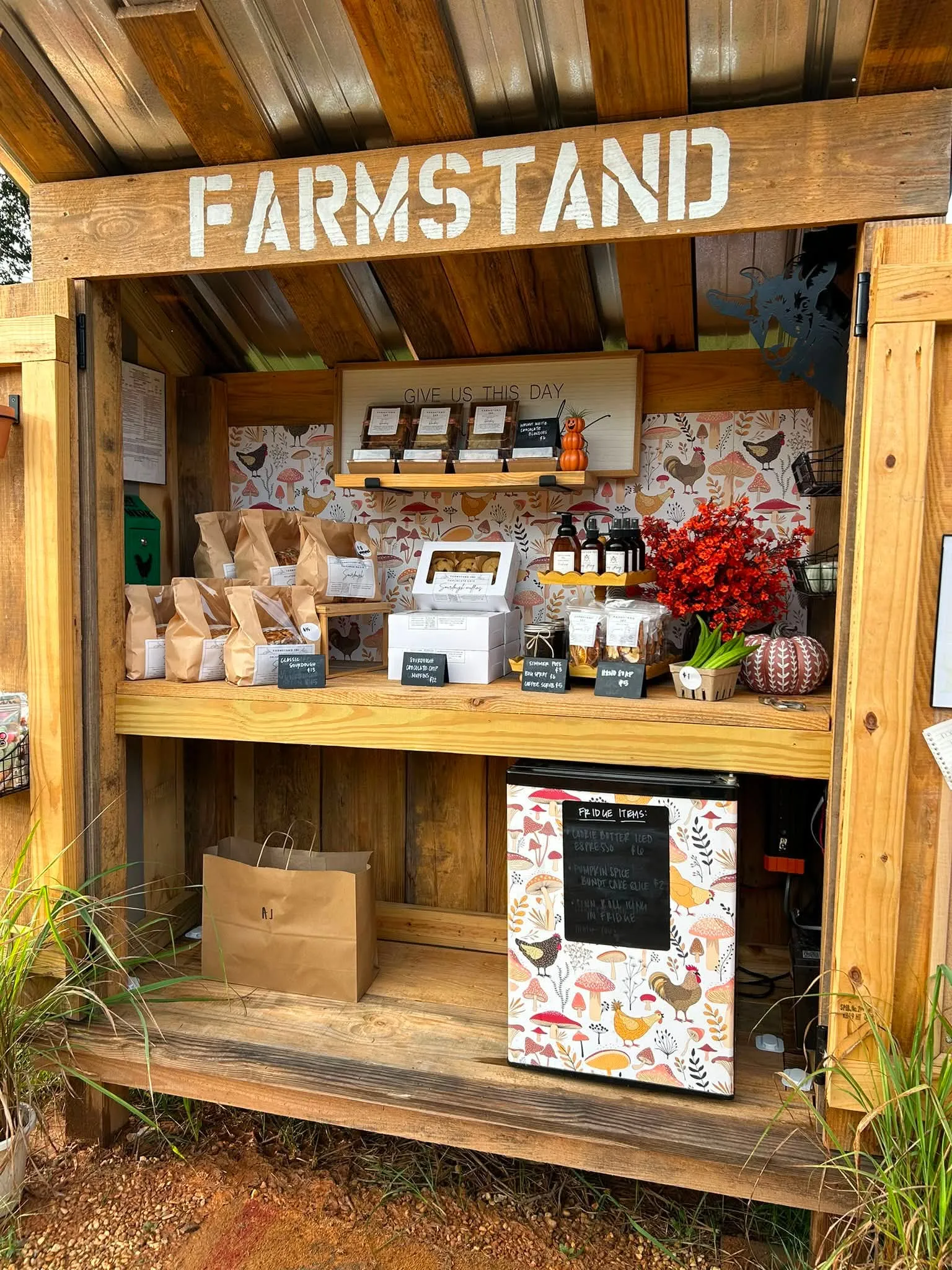 The Farmstand 382 shelves stocked with sourdough loaves, muffins and jarred goods